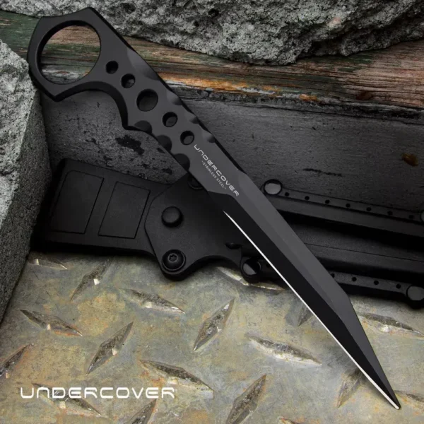 Фиксированный скрытный нож Undercover CIA Stinger II BO‑02UC3513, клон United Cutlery, цельнометаллический 3Cr13 клинок 3,5″ (~89 мм) в черном матовом покрытии, рукоять из цельной стали с отверстиями и кольцом у эфеса, нейлоновые ножны с быстросъемной кли